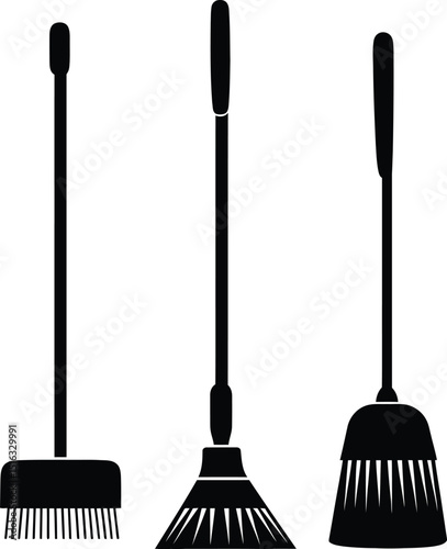 Three black brooms with different heads standing side by side on a white background in a simple drawing