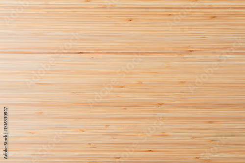 High angle view of a natural light brown bamboo wood surface texture showing the grain and natural patterns suitable for backgrounds