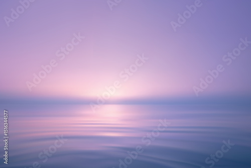 Dreamy ocean scene with soft pink purple sunrise
