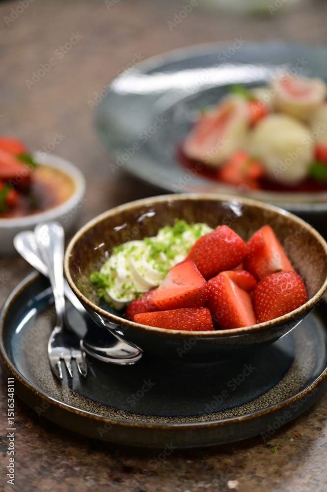 Close-up of fresh ripe strawberries placed on a rustic wooden table, highlighting the vibrant red color and natural texture Close-up of fresh ripe strawberries placed on a rustic wooden table, highlighting the vibrant red color and natural texture