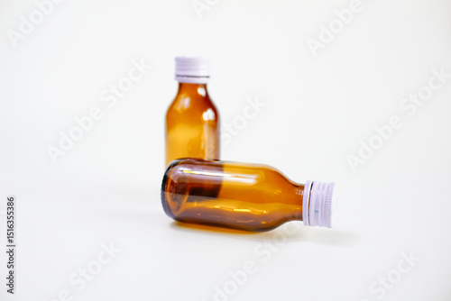 glass pill bottle isolated on white
