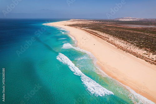 Beautiful tropical beach on Boa Vista Island, Cape Verde, featuring golden sand, clear turquoise water, and a sunny blue sky – ideal travel and vacation destination