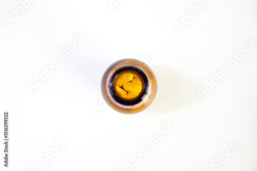 brown glass bottle for supplement product isolated on white background with clipping path