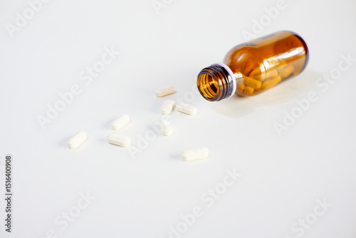 brown glass bottle for supplement product isolated on white background with clipping path