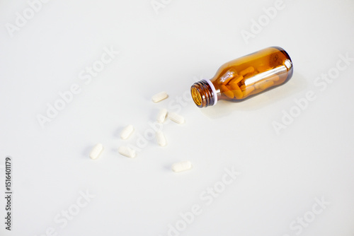brown glass bottle for supplement product isolated on white background with clipping path