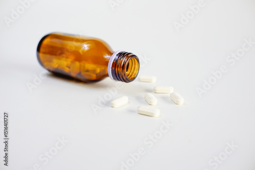 brown glass bottle for supplement product isolated on white background with clipping path