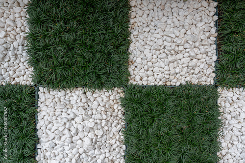 Grass and stones in a checkerboard pattern