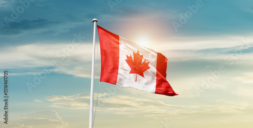 Canada national flag waving in the sky with mast.  photo