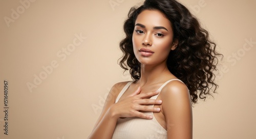 Young woman with a slim body and smooth, clean skin. Laser hair removal concept beige gradient background.	