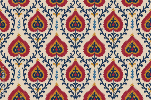 Traditional ikat seamless pattern with red, blue, and yellow floral elements on beige background, ethnic textile design for fabric, wallpaper, fashion prints, home decor and crafts.