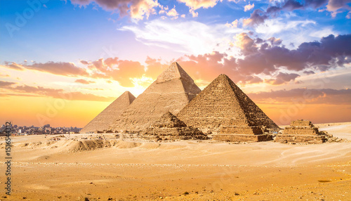 Ancient stone pyramids at sunset. Landscape of Egyptian desert. Travel banner, tourism