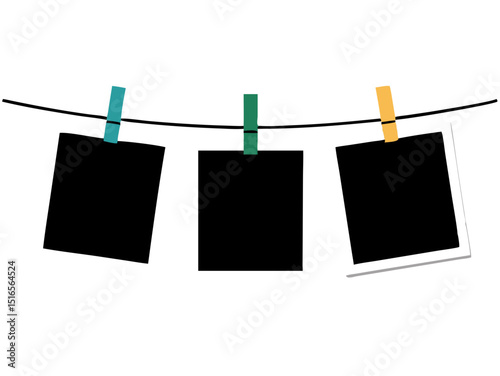 blank instant photos hanging on clothesline