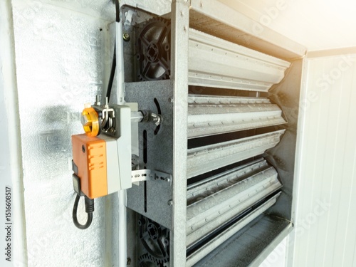 Close up the air damper actuator with automation open  close  damper blades on the ventilation duct.