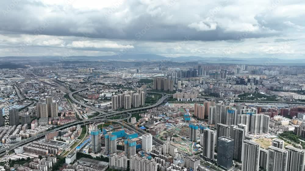 Grand view of Kunming City showing urban sprawl and construction Grand view of Kunming City showing urban sprawl and construction