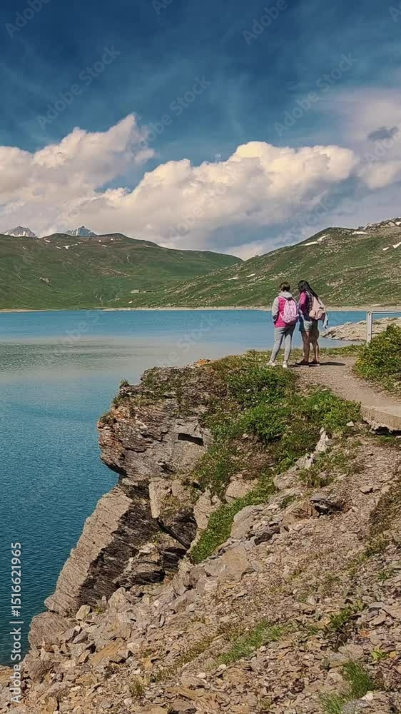 Alpine Lake Hiking Adventure: Couple Enjoys Scenic Mountain Trail Alpine Lake Hiking Adventure: Couple Enjoys Scenic Mountain Trail