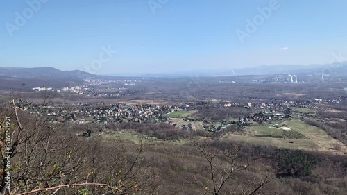 A vast, forested landscape with villages during fall - top view