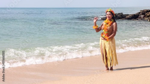 Hula Hawaii dancer dancing on the sea beach, slow motion