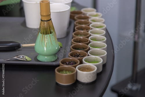 Matcha preparation station with various ingredients in a modern kitchen