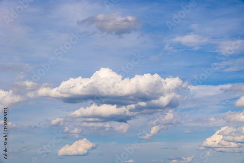 Cumulus clouds in blue sky on spring day