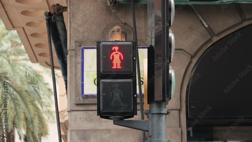 Red traffic light with a building in the background. High quality 4k footage