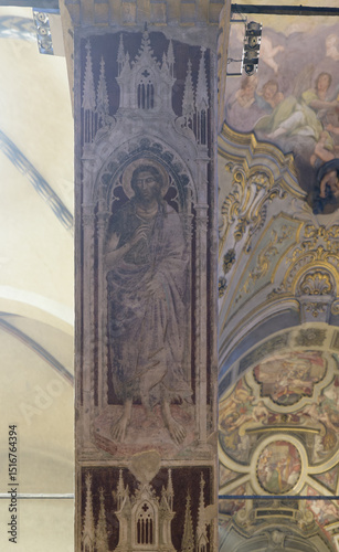 Fresco of a standing saint, likely Saint John the Baptist, by Mariotto di Nardo, early 15th century, on a pillar in Santa Maria Maggiore, Florence, Italy. photo