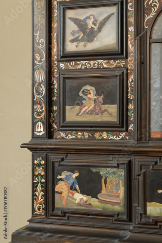 Ebony cabinet with pietre dure inlays showing mythological scenes, animals, and floral decorations in Sala di Gualdrada, Palazzo Vecchio, Florence, Italy.
