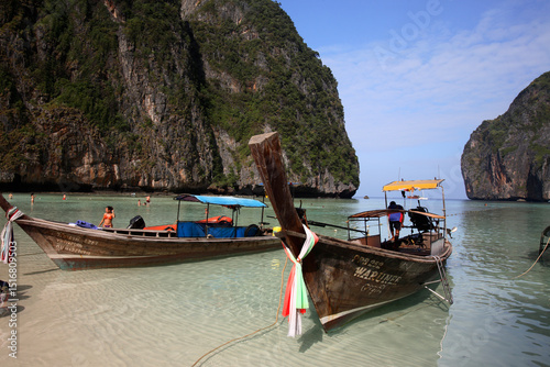 Long-tail boats in Maya Bay, Phi Phi Leh Island, Thailand photo