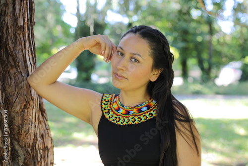 Native American woman with traditional colorful outfit 