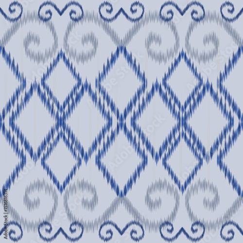 Traditional ikat weaving, this deep blue swirl pattern features bold motifs in a symmetrical layout. Classic Blue Tribal Swirl Ikat Pattern. Ideal for coastal decor, stationery, or fashion prints.