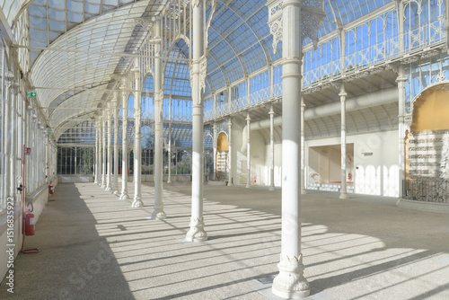 Historic glass and iron greenhouse in the Giardino dell'Orticultura, a 19th-century structure in Florence, Italy, for horticultural exhibitions.