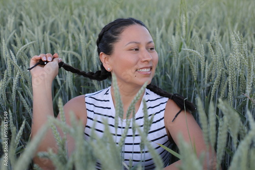 Pretty South American woman in agricultural fields 