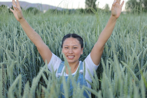 Pretty South American woman in agricultural fields 