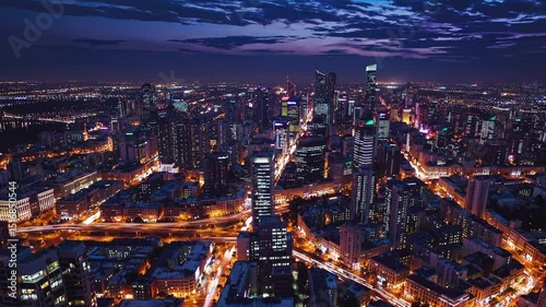 Wallpaper Mural Aerial View of a City at Sunset, Illuminated Streets and Skyscrapers Torontodigital.ca