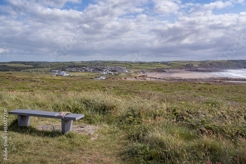 Εκτύπωση καμβά Memorial flowers left on bench looking down to Widemouth Bay