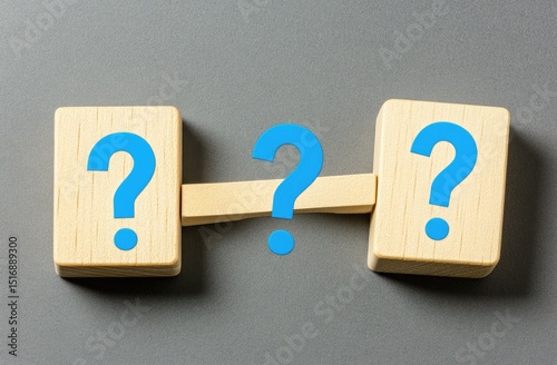 Wooden blocks with question marks, representing uncertainty or a problem