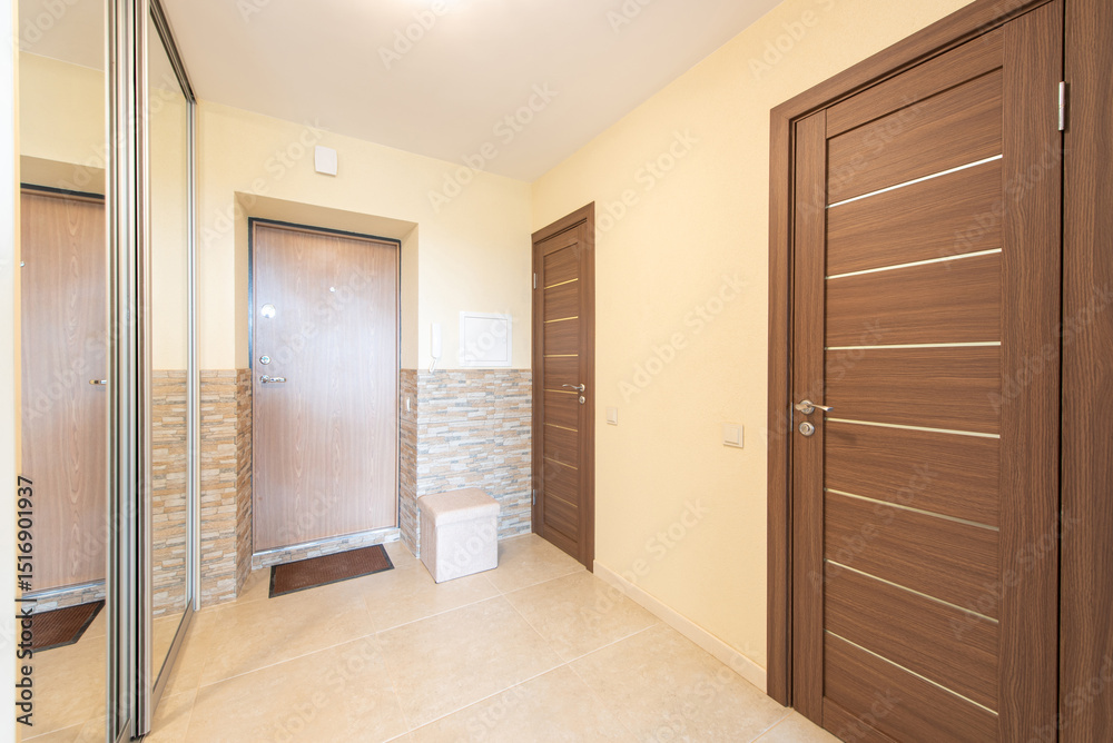 Fototapeta premium Modern Home Residential Hallway with Minimalist Design and Wooden Doors