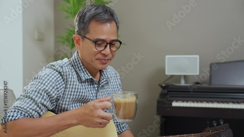 Wallpaper Mural Cozy Indoor Relaxation Man Sitting with Glasses, Enjoying Coffee and Music in Casual Lifestyle of Tranquility and Creativity Torontodigital.ca