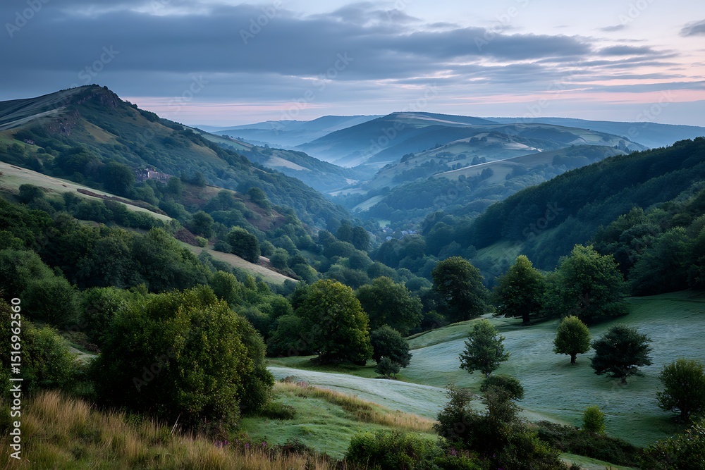 Naklejka premium Lush green hills and trees creating a serene, harmonious landscape at dawn, as soft light highlights the peaceful beauty of nature's untouched wonder.