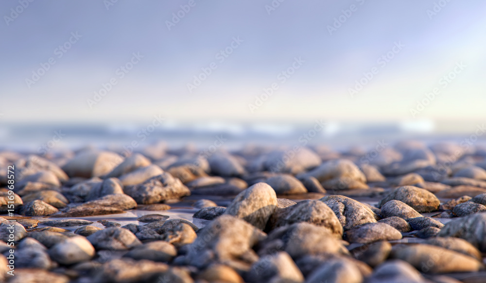Obraz premium Natural pebbles on a tranquil beach shore and soft-focus ocean background. Serene calming scene, natural beauty. For travel, tourism, wellness, environmental background visuals, versatile designs, 3D