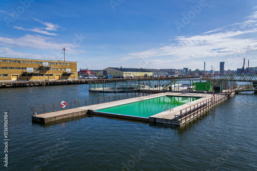Floating swimming pools with sauna at Allmanna harbour bath in Frihamnen, Gothenburg, Sweden, sunny day