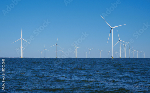Windmills (Wind Turbines) at sea. Wind power plant at sea
