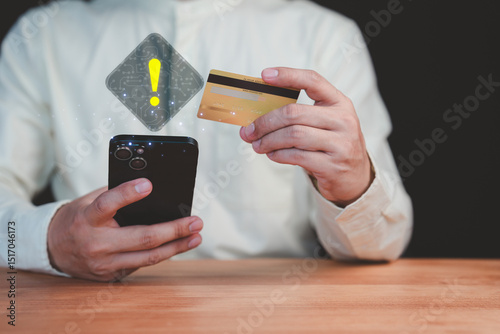 Adult man holding a credit card and mobile phone with a warning sign overlay, symbolizing online scams, fraud, security risks, transfer money and financial caution in digital transactions.