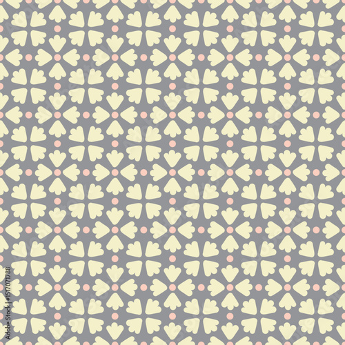 Flower petal seamless pattern vector. Polka dot floral motif tiled graphic in yellow and orange over gray.