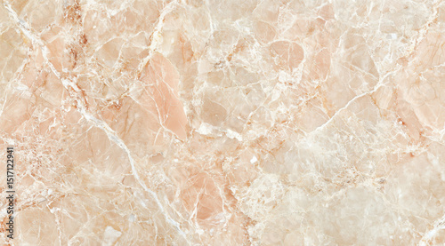 Polished background of light pink marble with natural veining and texture