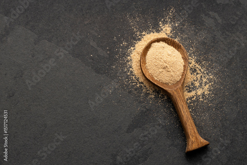 Organic Peruvian maca powder in spoon - Lepidium meyenii