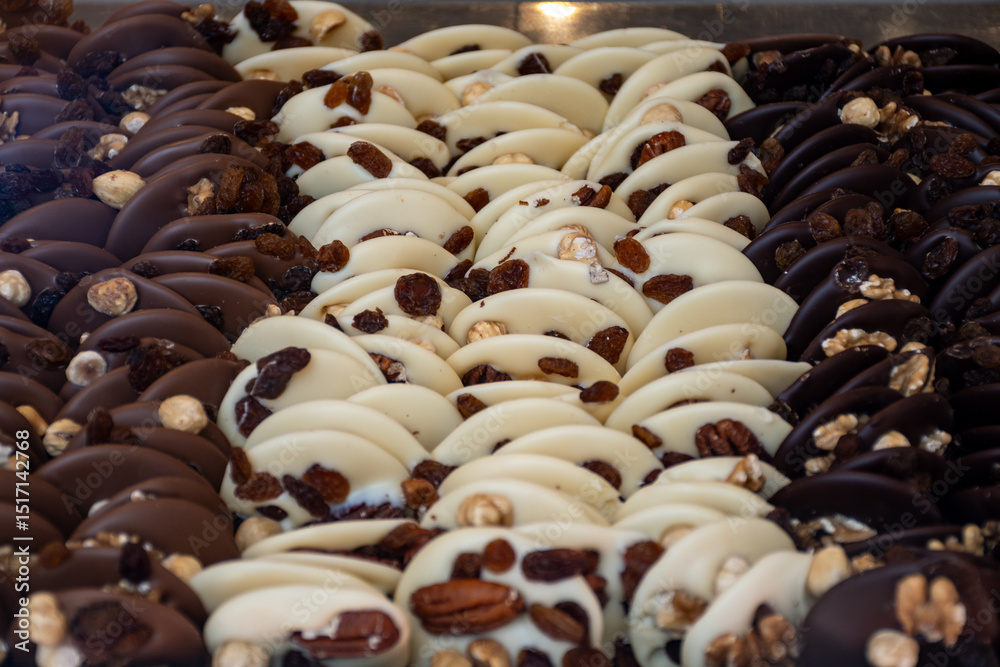 Naklejka premium Famous Belgian chocolate candies on display in confectionery shop in Bruges, Belgium