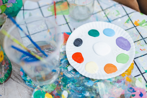 Wallpaper Mural Sustainable and ecofriendly craft setup with painting palette filled with art colors on table, inspiring creativity and artistic expression in bright environment Torontodigital.ca