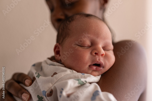 Parent holding sleeping baby