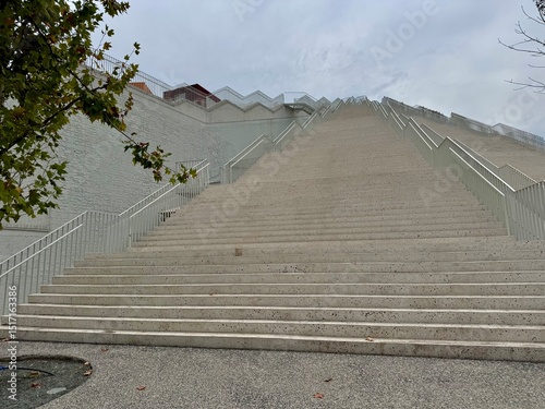 view of the stairs of the Tirana pyramid in the city center on a cloudy summer day

