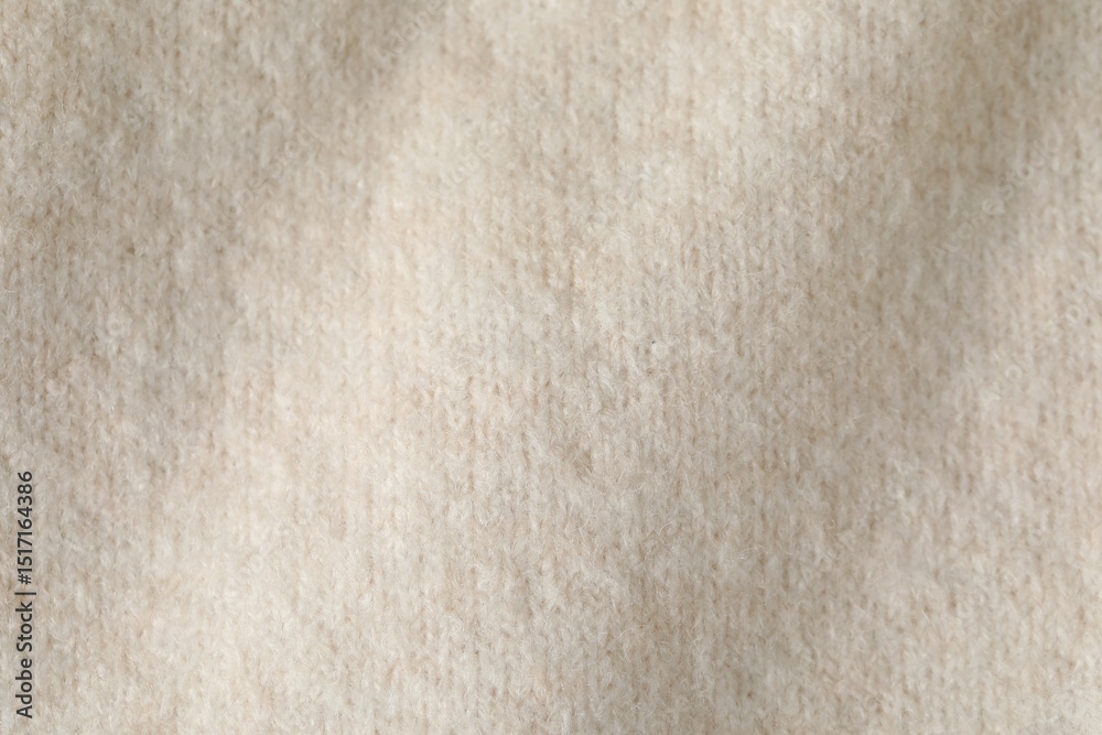 Texture of beige wool fabric as background, top view